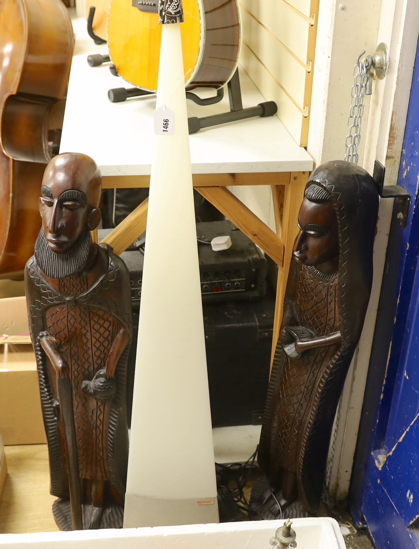 A pair of large African hardwood figural carvings and a Mathmos floor lamp